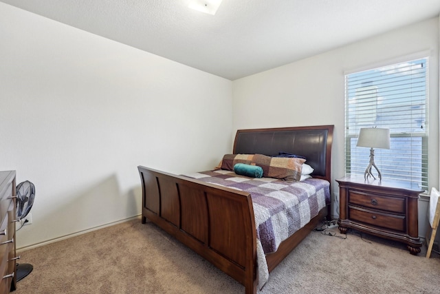 bedroom featuring light carpet