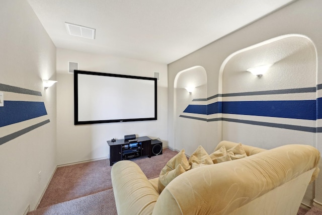 carpeted home theater with visible vents