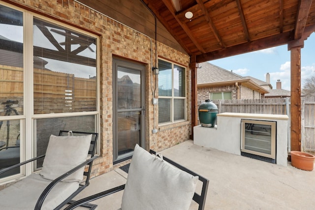 view of patio featuring fence