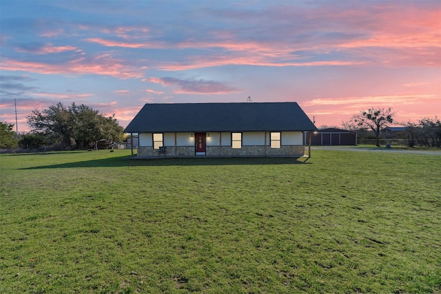 view of front of property with stone siding and a front yard