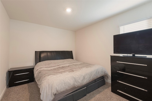 bedroom featuring baseboards and carpet floors