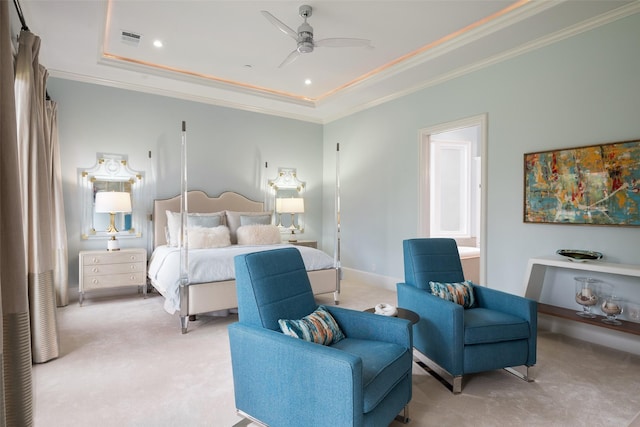 carpeted bedroom with visible vents, a tray ceiling, recessed lighting, crown molding, and baseboards