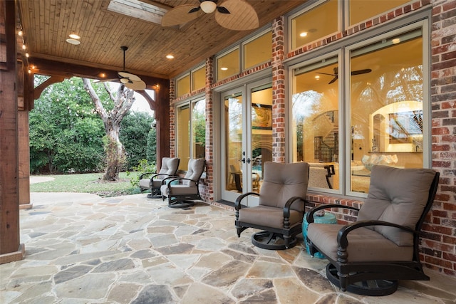 view of patio featuring french doors and ceiling fan