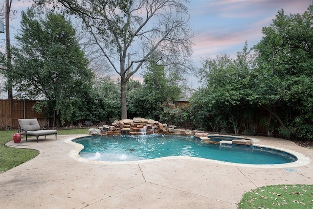 view of pool with a patio, a pool with connected hot tub, and a fenced backyard