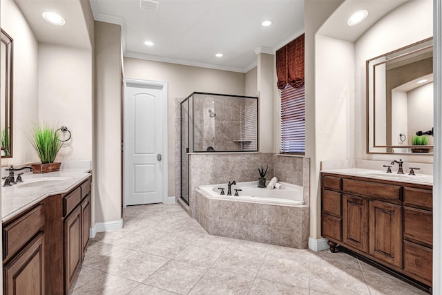 full bathroom featuring a shower stall, crown molding, a garden tub, and a sink