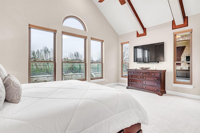 carpeted bedroom with beamed ceiling, high vaulted ceiling, baseboards, and a ceiling fan