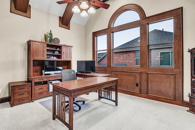 office with light colored carpet, baseboards, lofted ceiling with beams, and a ceiling fan