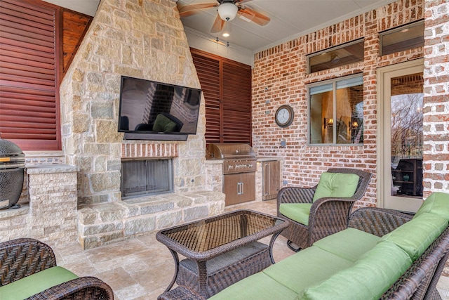 view of patio / terrace featuring grilling area, area for grilling, a ceiling fan, and an outdoor living space with a fireplace