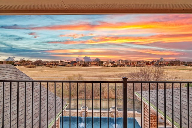 balcony at dusk with a residential view