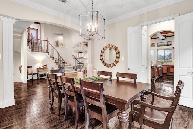 dining space featuring arched walkways, stairway, dark wood-type flooring, and a notable chandelier