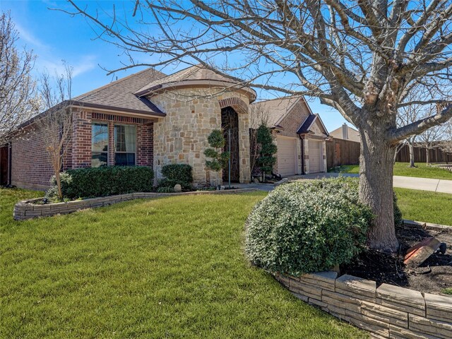 view of front of house featuring fence, an attached garage, a shingled roof, a front lawn, and concrete driveway