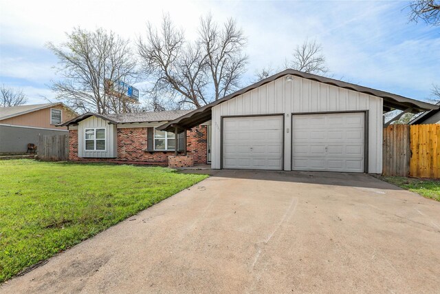 view of front of property featuring a garage, concrete driveway, brick siding, and board and batten siding