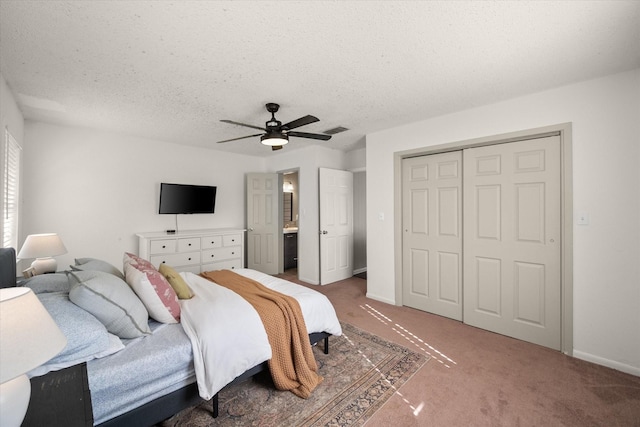 carpeted bedroom featuring visible vents, baseboards, ceiling fan, a closet, and a textured ceiling