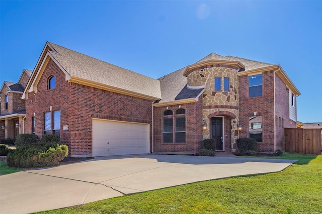 view of front facade featuring stone siding, fence, brick siding, and driveway