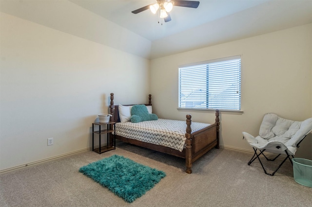 bedroom with baseboards, ceiling fan, carpet flooring, and vaulted ceiling