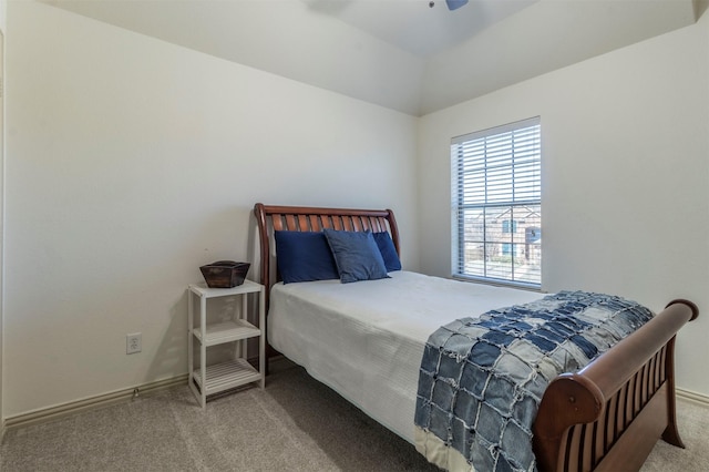 carpeted bedroom with a ceiling fan and baseboards