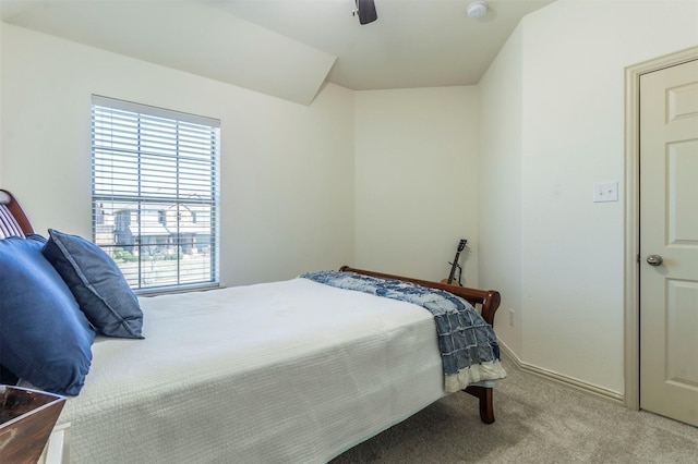 carpeted bedroom with baseboards and ceiling fan