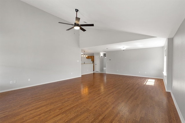 unfurnished living room featuring baseboards, wood finished floors, ceiling fan with notable chandelier, and high vaulted ceiling