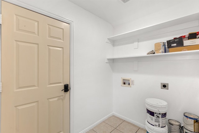 clothes washing area featuring hookup for a washing machine, light tile patterned floors, baseboards, hookup for an electric dryer, and laundry area