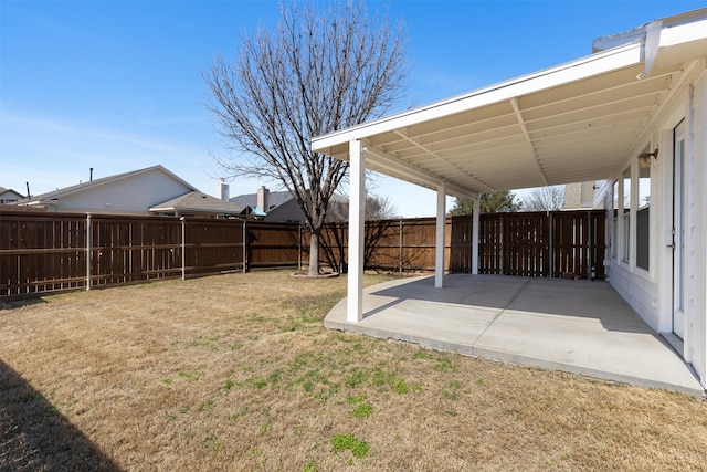 view of yard featuring a patio area and a fenced backyard