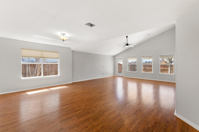 unfurnished living room with baseboards, plenty of natural light, ceiling fan, and wood finished floors