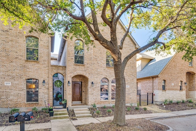 view of front of property featuring brick siding