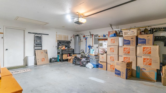 garage featuring water heater and a garage door opener