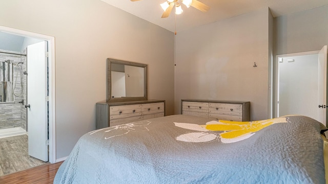 bedroom featuring vaulted ceiling, baseboards, ceiling fan, and wood finished floors