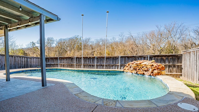 view of swimming pool with a fenced in pool, a patio, and a fenced backyard