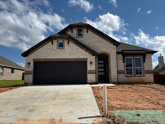 1412 Cedar Trl, Azle, TX 76020 - view of front of house with a garage and stone siding