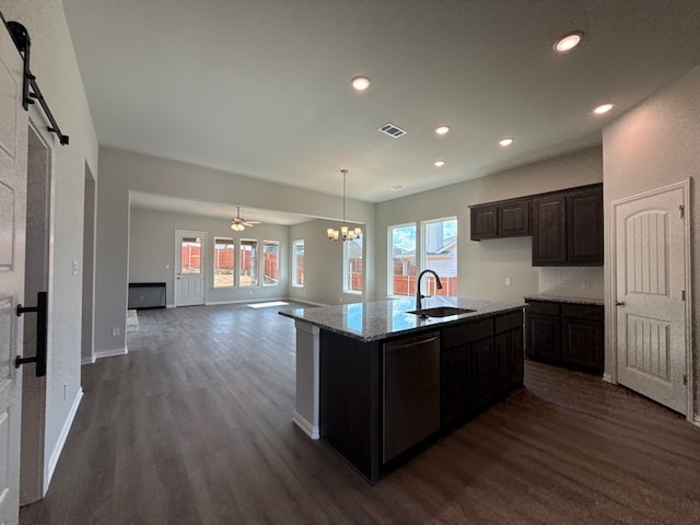 1412 Cedar Trl, Azle, TX 76020 - kitchen featuring a sink, dark wood-style flooring, healthy amount of natural light, recessed lighting, and light stone countertops