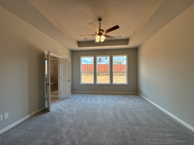 1412 Cedar Trl, Azle, TX 76020 - empty room featuring a ceiling fan, carpet, a raised ceiling, and baseboards