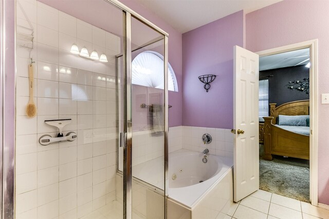 bathroom featuring tile patterned floors, a whirlpool tub, a stall shower, and ensuite bathroom