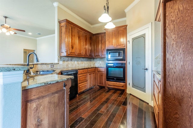 kitchen with light stone counters, dark wood-style floors, a sink, black appliances, and backsplash