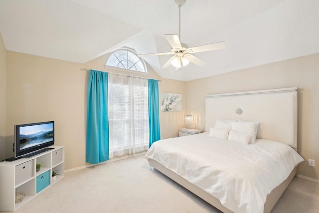 carpeted bedroom featuring ceiling fan, baseboards, and lofted ceiling