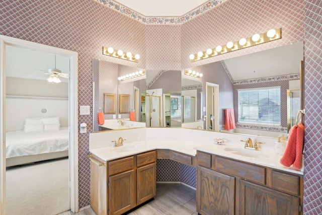 ensuite bathroom with wallpapered walls, vanity, a stall shower, tile patterned floors, and ensuite bath