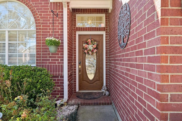 property entrance with brick siding