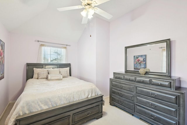 bedroom featuring light colored carpet, a ceiling fan, and vaulted ceiling