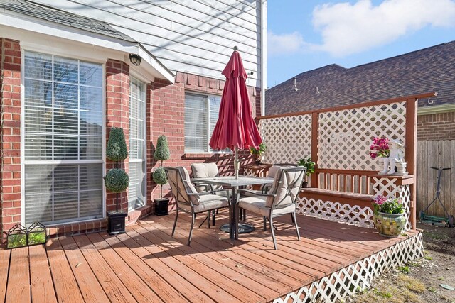 deck with outdoor dining area