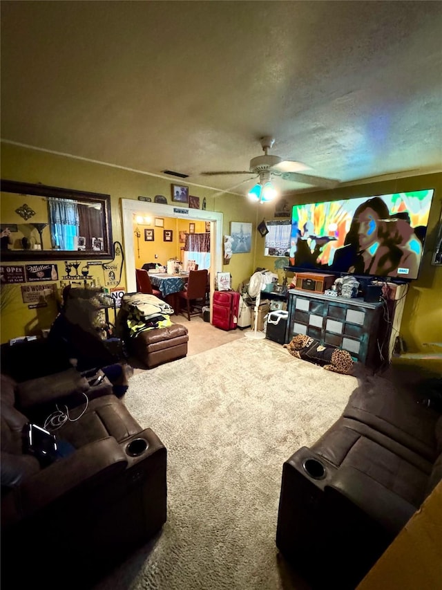 living area with carpet flooring and ceiling fan