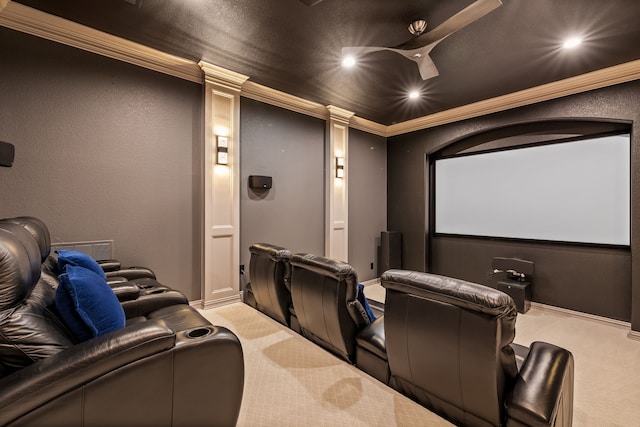 carpeted home theater room featuring decorative columns, recessed lighting, and ornamental molding