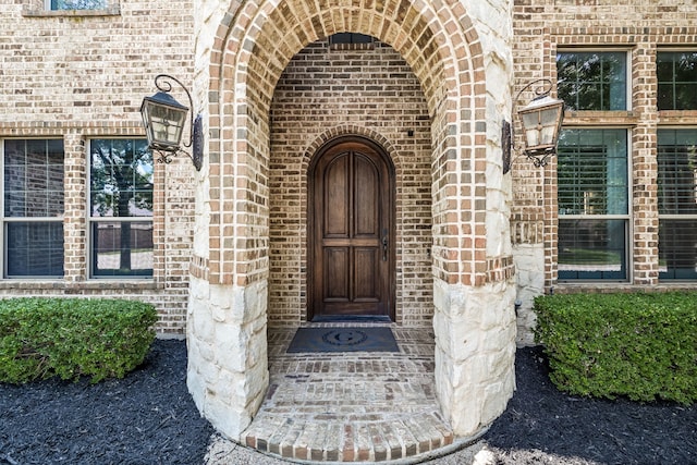 entrance to property with brick siding