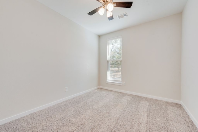 spare room featuring visible vents, ceiling fan, baseboards, and carpet floors