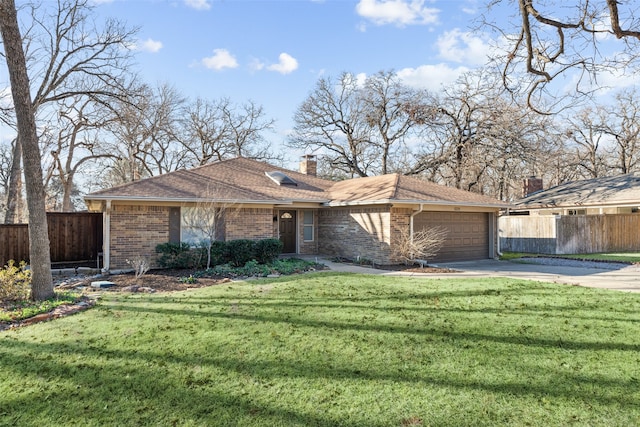 view of front of property with a front lawn, fence, concrete driveway, an attached garage, and brick siding