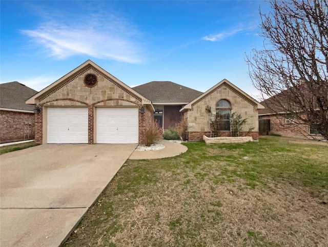 view of front of house featuring a front yard, driveway, stone siding, a garage, and brick siding