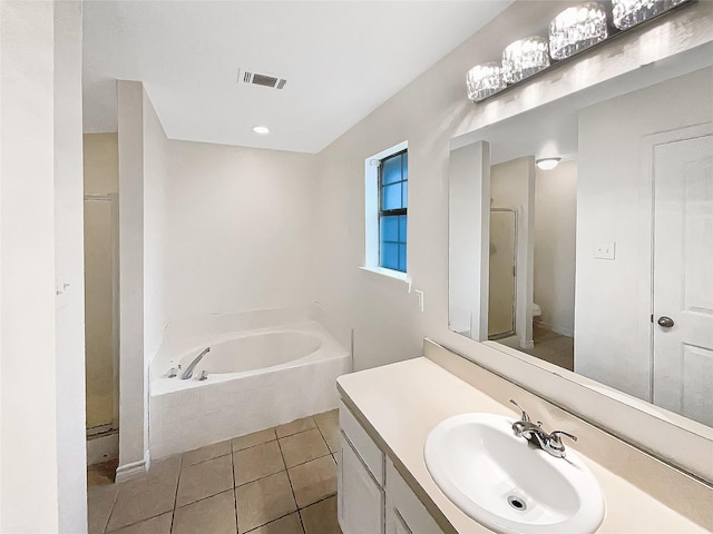 full bath with visible vents, a stall shower, tile patterned flooring, a bath, and vanity