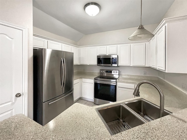 kitchen featuring a sink, stainless steel appliances, white cabinets, light stone countertops, and vaulted ceiling