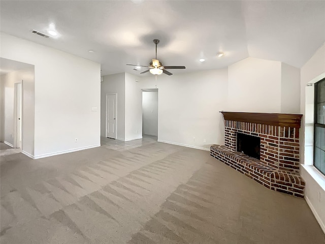 unfurnished living room featuring visible vents, a fireplace, ceiling fan, and carpet floors