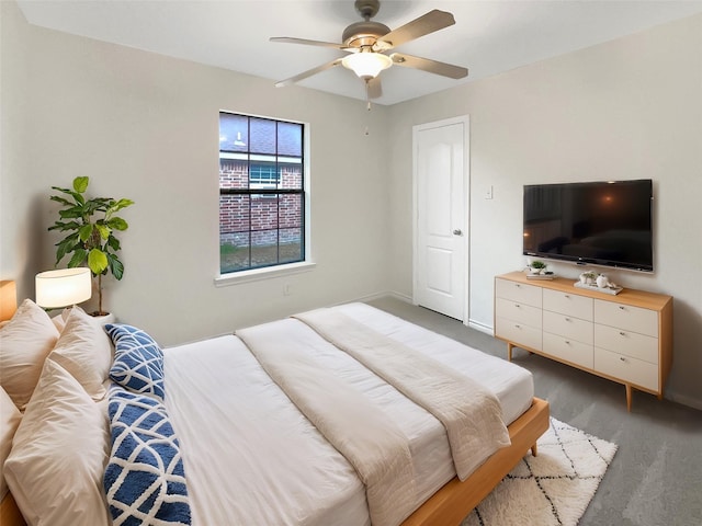 bedroom featuring baseboards and ceiling fan