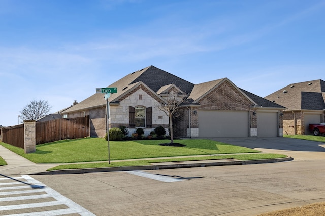 french country home featuring fence, brick siding, stone siding, and driveway